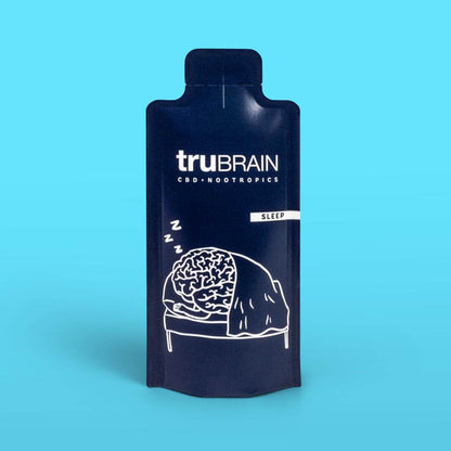 Closeup hero shot on blue background of the front of TruBrain’s Sleep drink which has Functional Oils & Nootropics for deep, restorative sleep